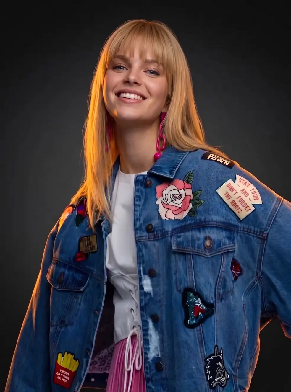 Woman wearing jean jacket with custom patches — sample pack